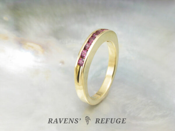 unique handmade 18k yellow gold half eternity band with rhodolite garnets