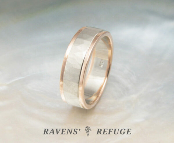 hammered white gold wedding band with rose gold rails