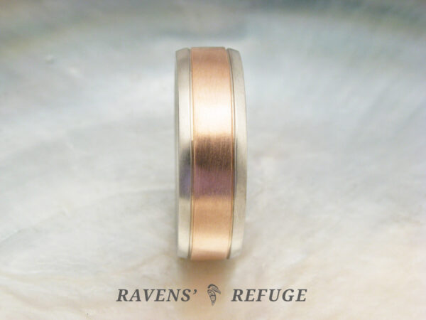 classy mens wedding ring with simple profile and mixed metals