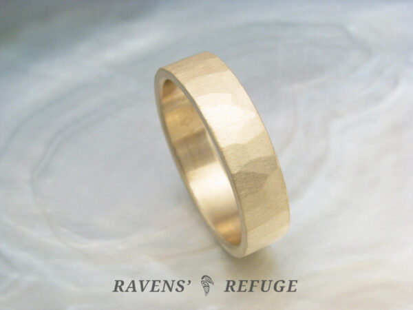 5mm custom wedding band with flat profile and subtle hammered, matte finish. 14k yellow gold.