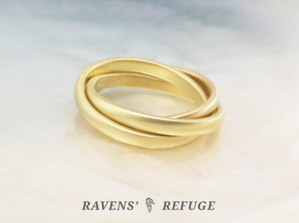 interlocking gold band ring