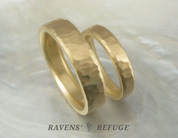 Matching yellow gold wedding bands with hammered finish. 5mm and 3mm rings with flat profile and comfort fit interior.