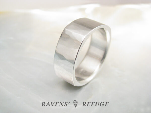 square platinum wedding band with subtle hammered finish