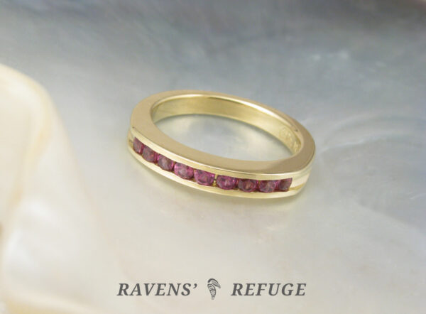18k yellow gold stacking ring with channel set rhodolite garnets